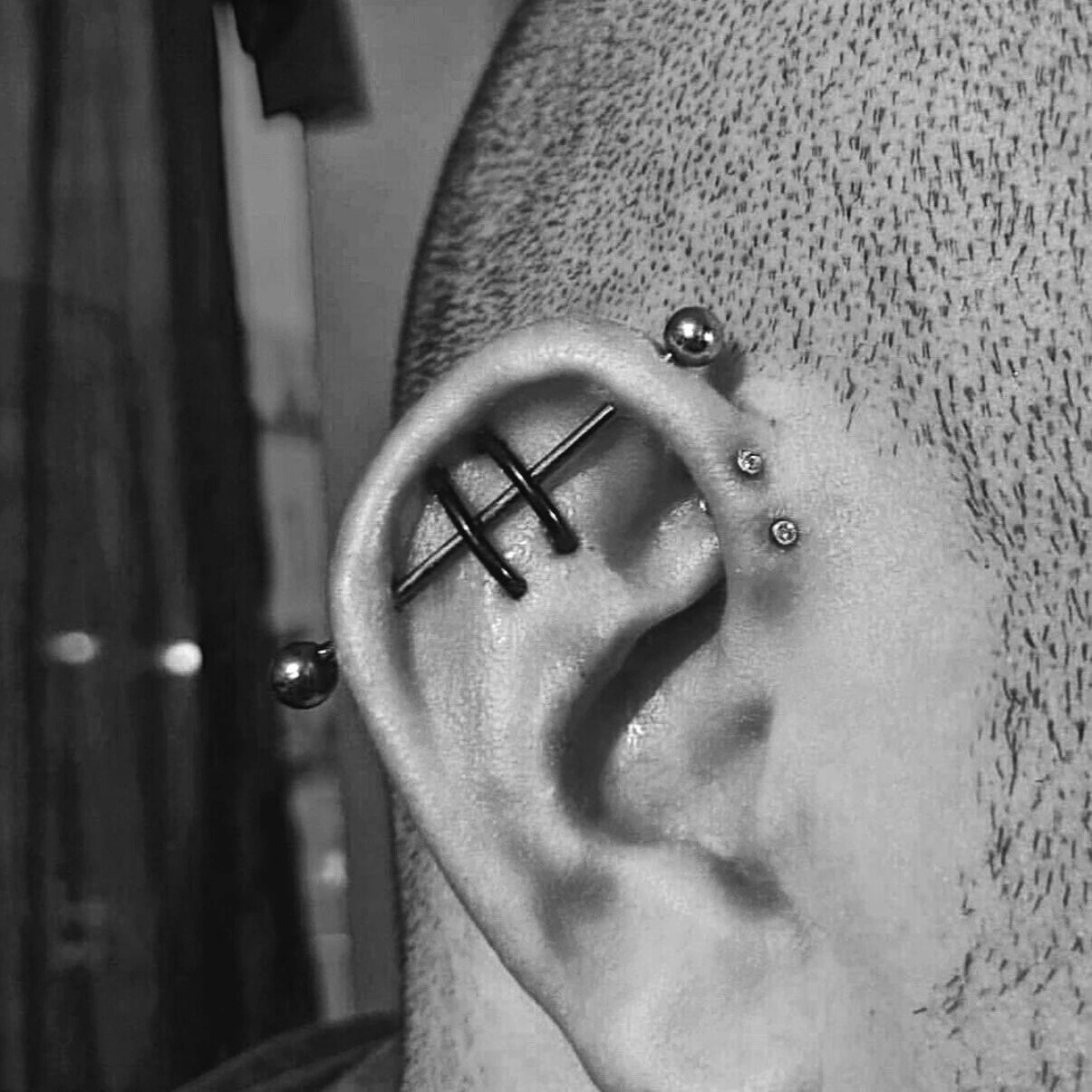 Multiple ear piercings with jewellery at Black Pearl Toronto